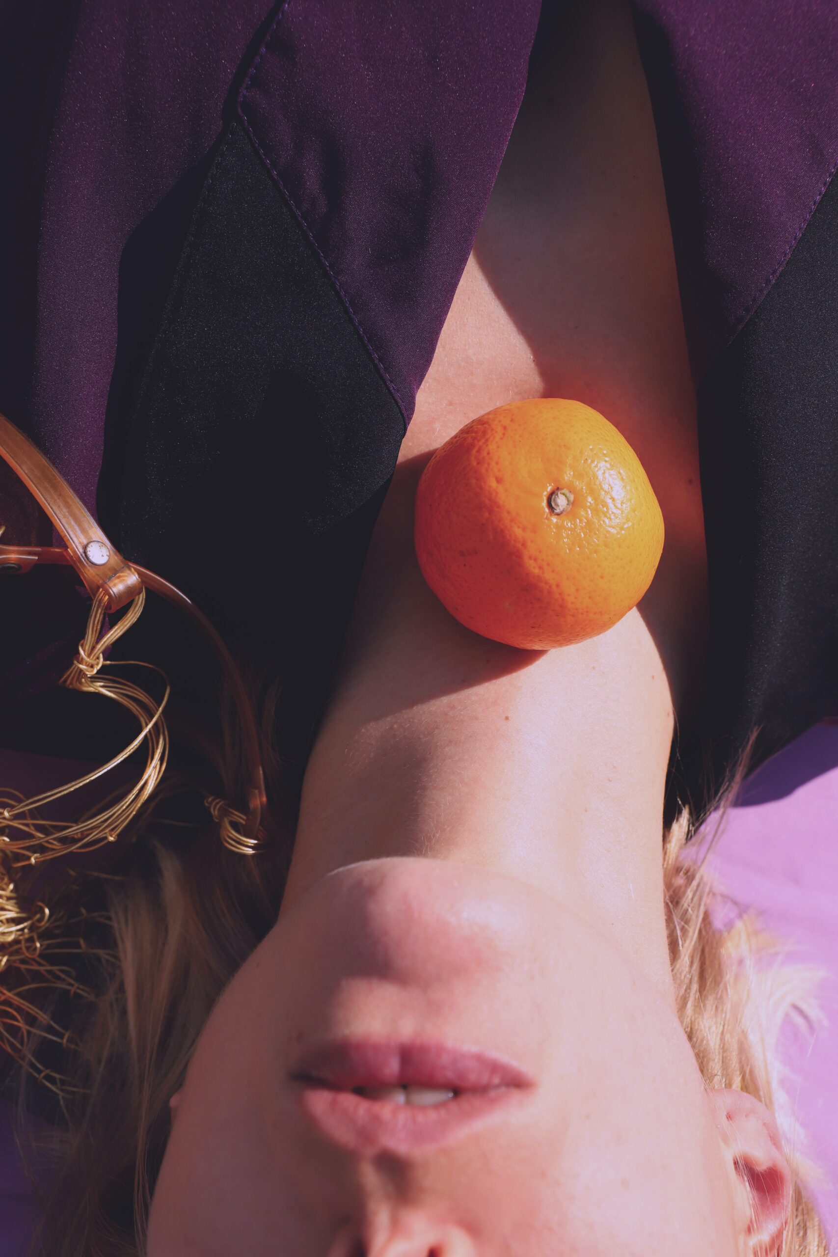 Woman with orange on her neck