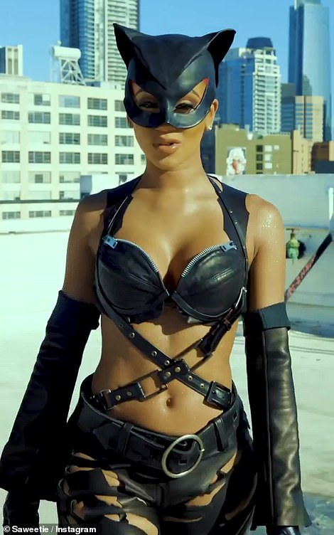 Saweetie dressed in halloween costume as Halle Berry Catwoman