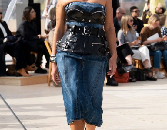 Model wearing Alexander McQueen Denim Dress on the runway