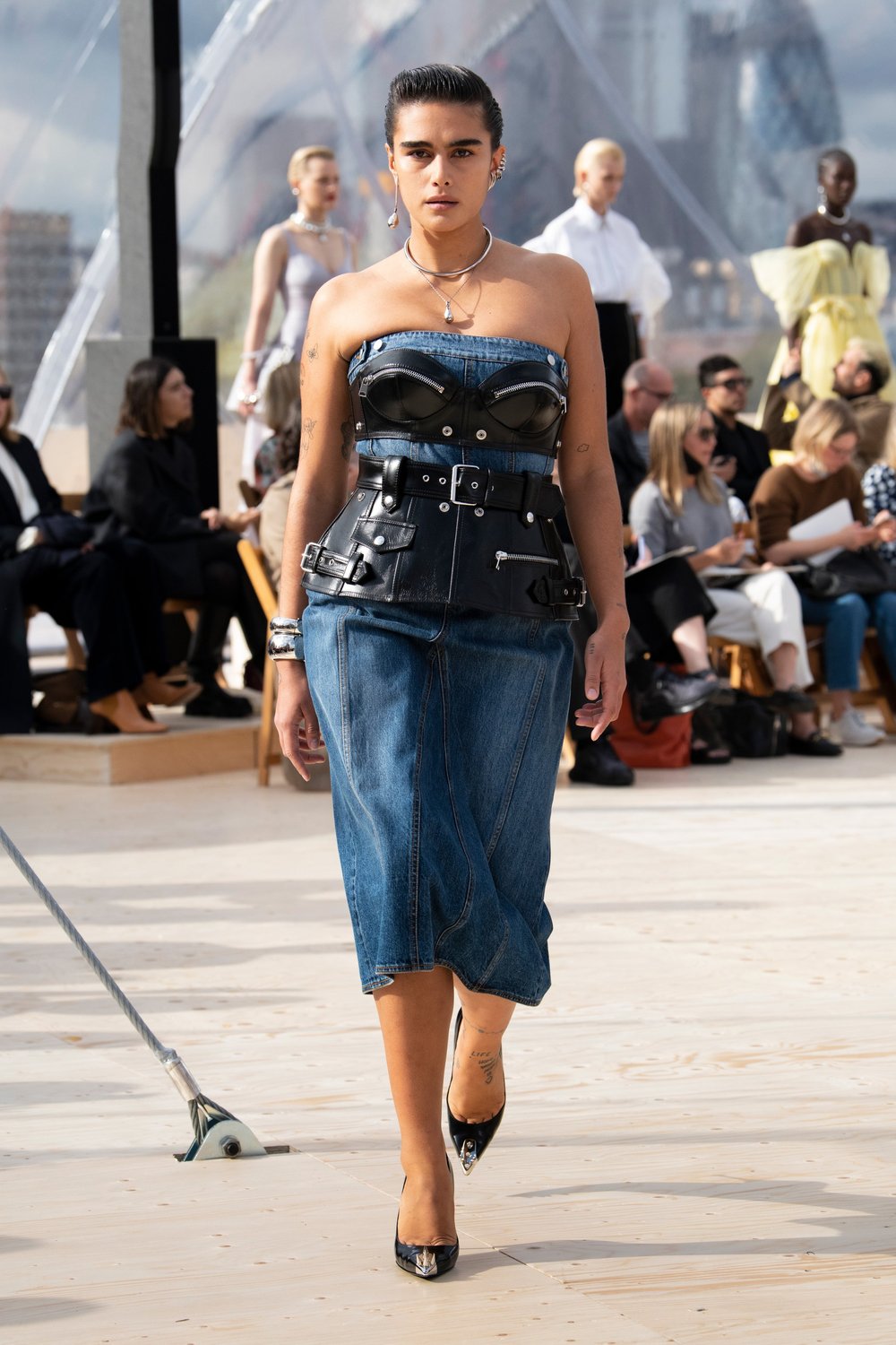 Model wearing Alexander McQueen Denim Dress on the runway