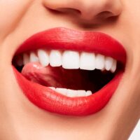 The 8 Summer Neon Orange-Red Lipsticks To Brighten Your Face